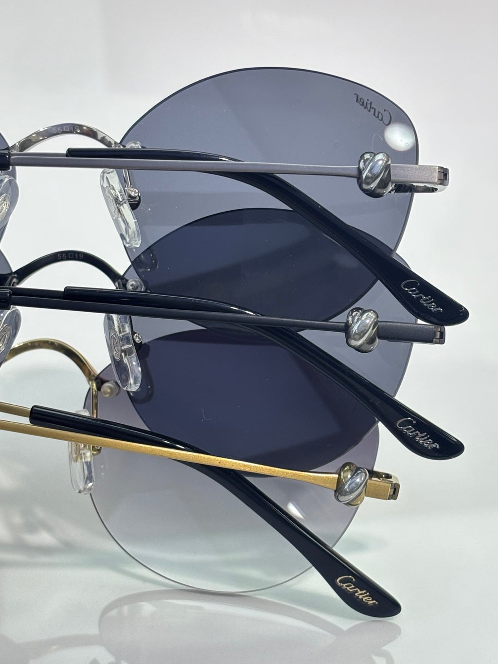 Cartier round sunglasses closeup showing dark lenses and silver-tone arms