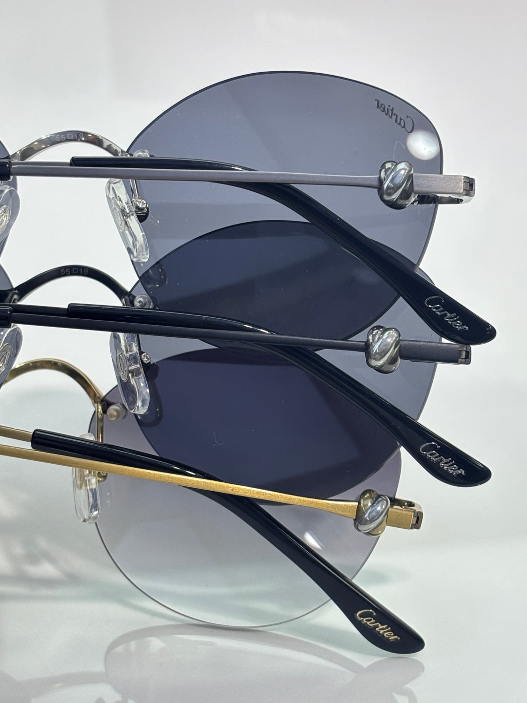 Cartier round sunglasses closeup showing dark lenses and silver-tone arms