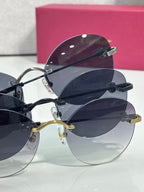 Cartier round sunglasses closeup with stacked frames, dark lenses, and metal temples