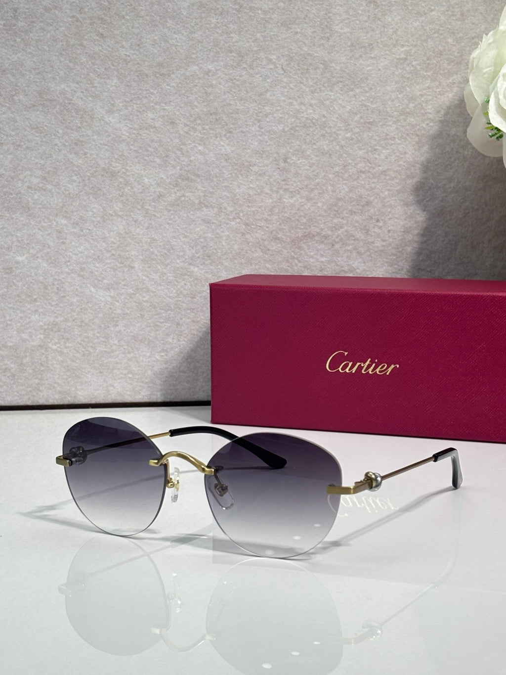 Cartier round sunglasses with gradient dark lenses and silver-tone metal frames