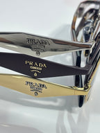 Prada sunglasses arms close-up with engraved PRADA MILANO and gold accents