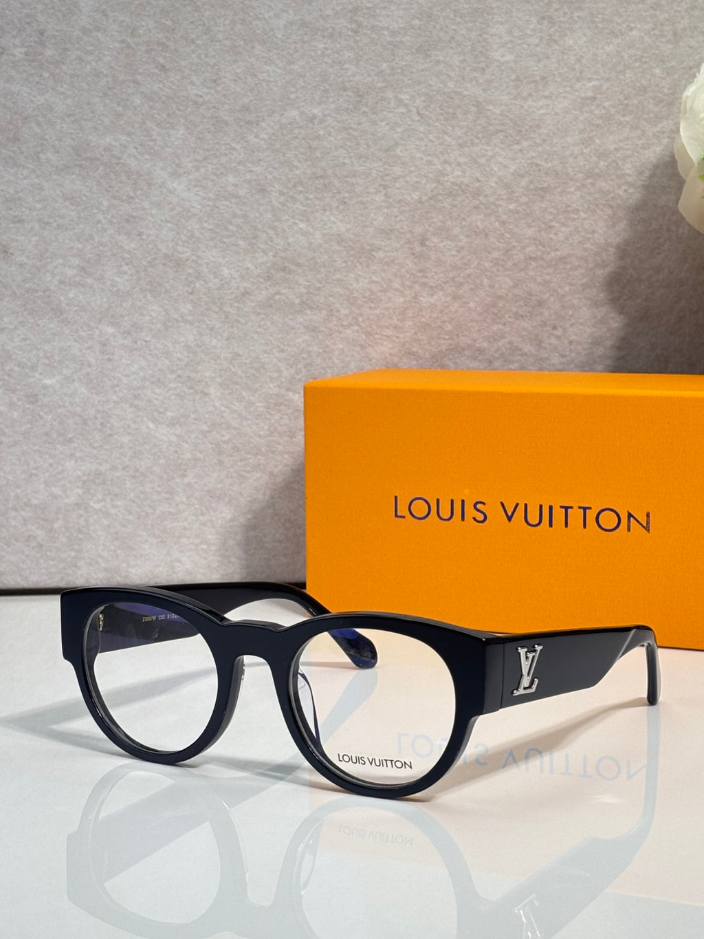 Eyeglasses with dark blue-black frame and clear lenses, Louis Vuitton logo temple