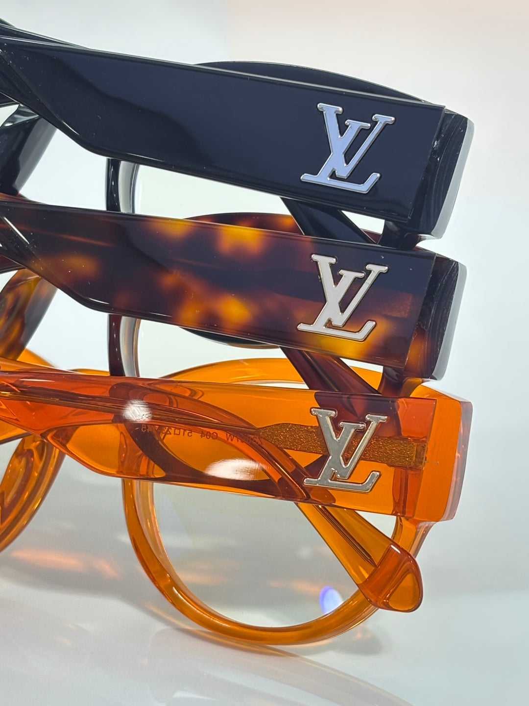 Eyeglasses with LV monogram on navy and tortoise temples, clear lenses