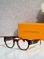 Tortoise-pattern eyeglasses with brown frames and clear lenses