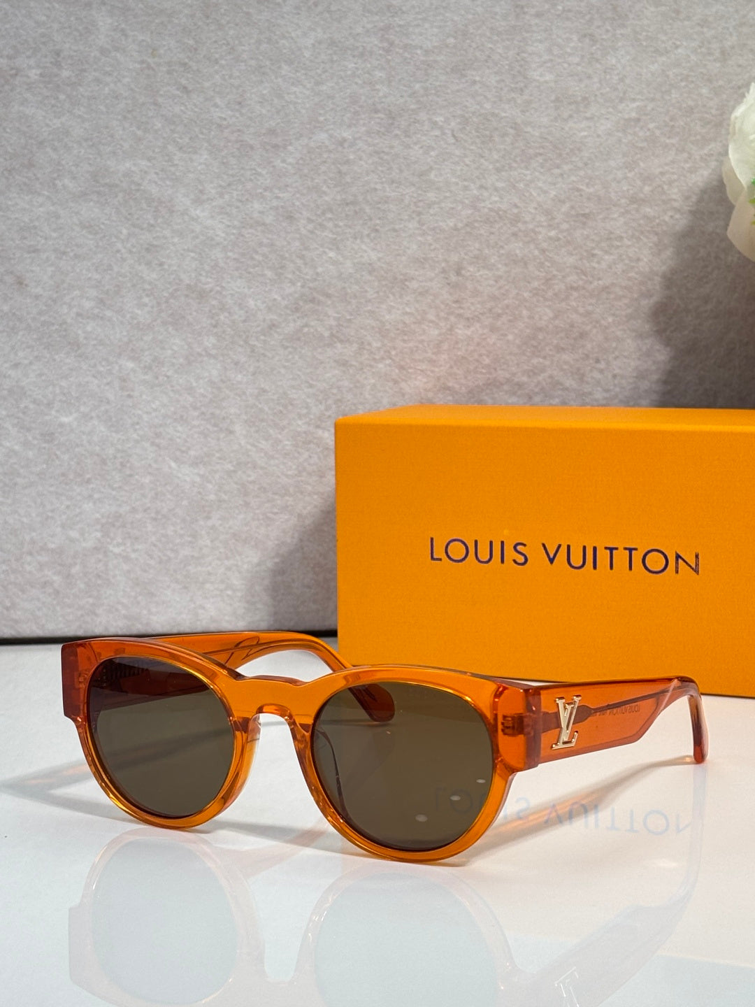 Sunglasses with amber tortoiseshell frames and dark lenses