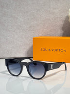 Sunglasses with black frames and dark blue-tinted lenses
