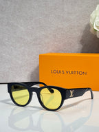 Louis Vuitton sunglasses with dark lenses and black rounded frames