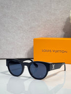 Sunglasses with dark lenses and black frames, blue tint