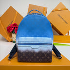 Blue monogram backpack with top handle, front zip pocket, and shoulder straps