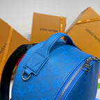 Blue monogram backpack with metal zipper and curved top handle