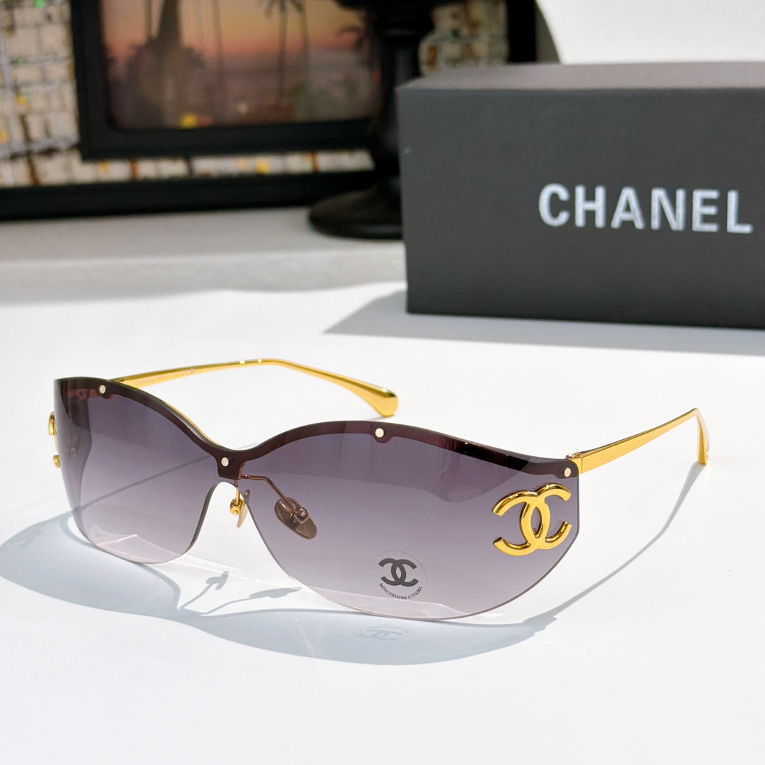 Dark brown cat-eye sunglasses with tinted lenses and gold-tone logo hardware
