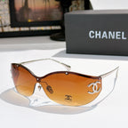Brown cat-eye sunglasses with orange-tinted lenses and gold-tone logo hardware