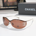 Brown cat-eye sunglasses with tinted lenses and gold-tone logo hardware