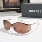 Brown cat-eye sunglasses with tinted lenses and gold-tone logo hardware