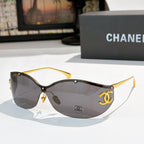 Black cat-eye sunglasses with dark gray tinted lenses and gold-tone logo hardware