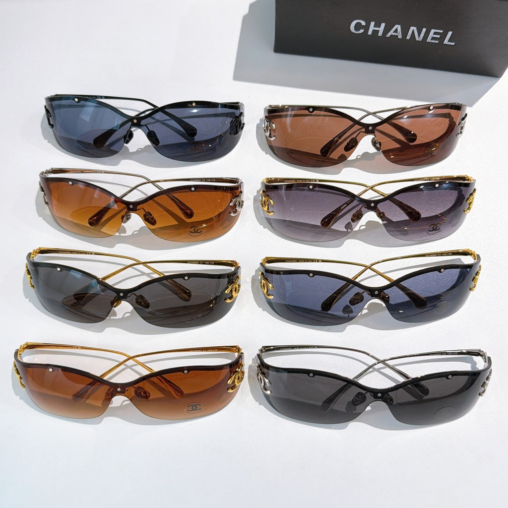 Assorted cat-eye sunglasses set with tinted lenses and gold-tone logo hardware
