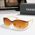 Dark brown cat-eye sunglasses with orange-brown tinted lenses and gold-tone logo hardware