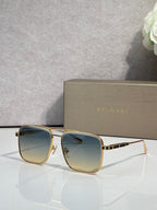 Bvlgari sunglasses with gold-tone frames and blue gradient tinted lenses