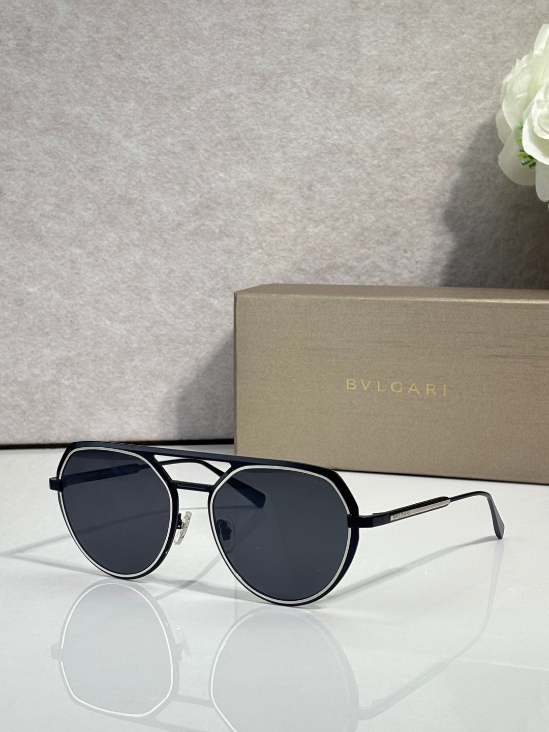 Bvlgari round sunglasses with navy lenses and dark metal frame