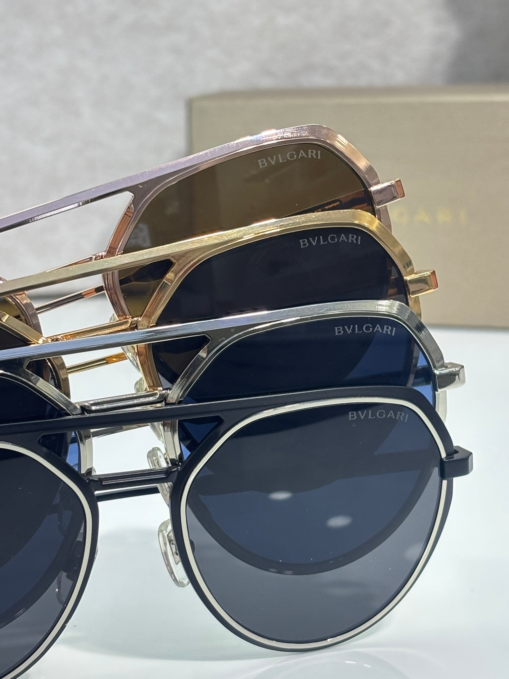 Bvlgari sunglasses close-up with gold and navy frames