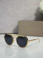 Bvlgari round sunglasses with dark lenses and gold metal frame