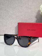 YSL sunglasses with dark tortoiseshell frame and smoky lenses