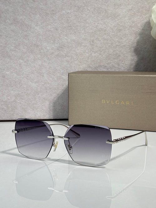 Gold-framed sunglasses with purple-tinted lenses and slim metal temples