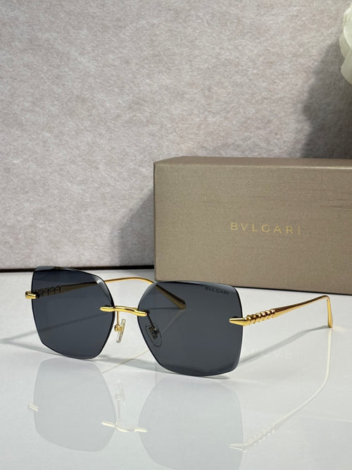 Gold-framed sunglasses with dark blue lenses and slim metal temples