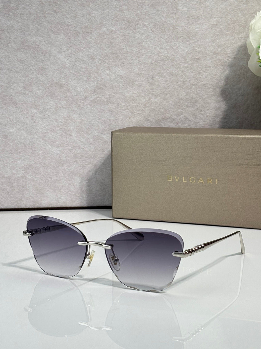 Bvlgari sunglasses, gold frame, dark blue gradient lenses with slim metal temples