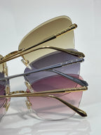 Bvlgari sunglasses side view, gold frame, purple gradient lenses, slim metal temples