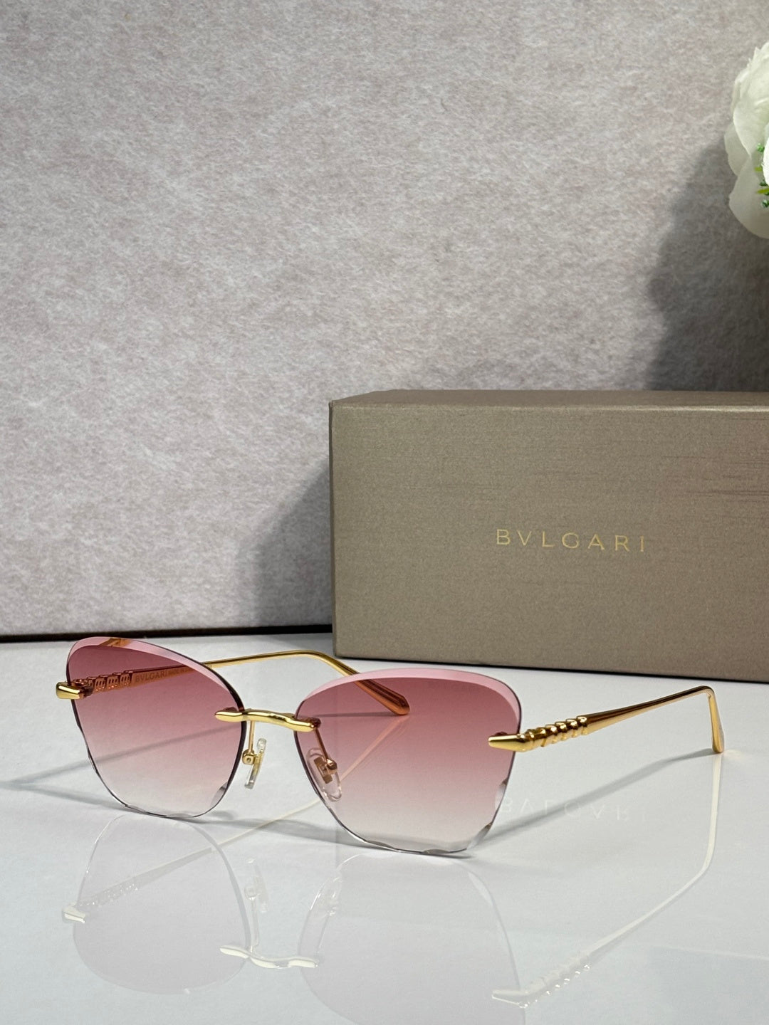 Bvlgari sunglasses, gold frame, pink gradient lenses with slim metal temples