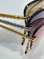 Bvlgari sunglasses temple detail, gold and silver bars on hinge with mirrored lenses