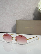 Bvlgari sunglasses with gold-tone frame and pink gradient lenses