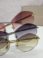 Bvlgari sunglasses with gold frames and mixed tinted lenses