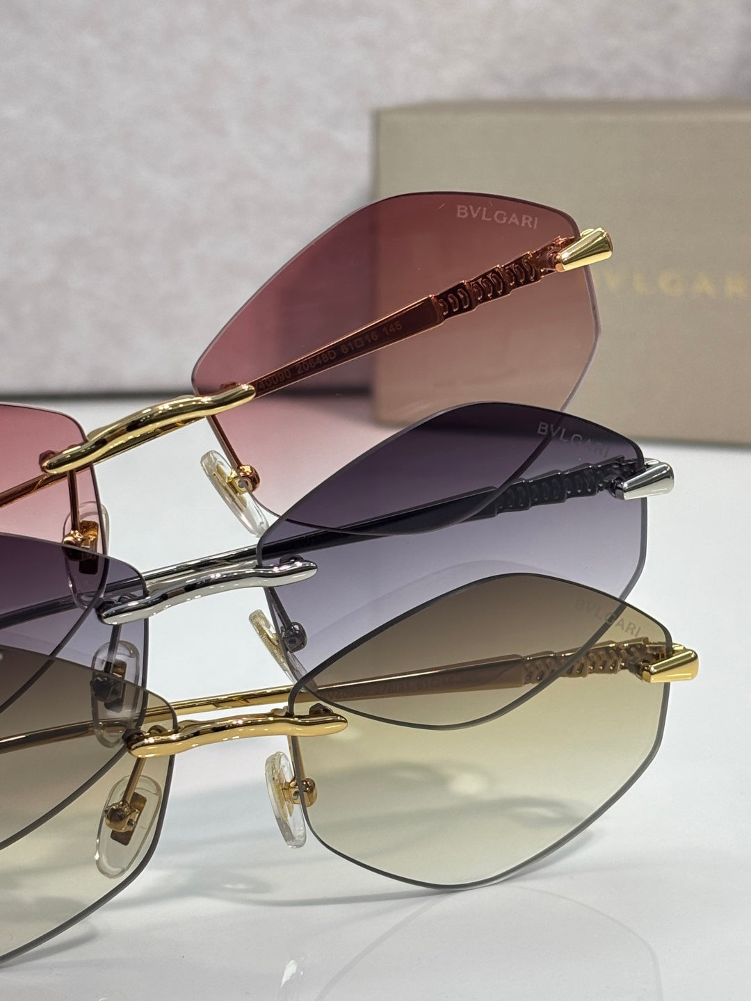 Bvlgari sunglasses with gold frames and mixed tinted lenses