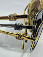 Chanel sunglasses close-up of gold-tone temples with Double-C charms