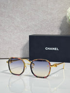 Chanel round sunglasses with light gradient lenses, gold-tone frame and multicolor top rim