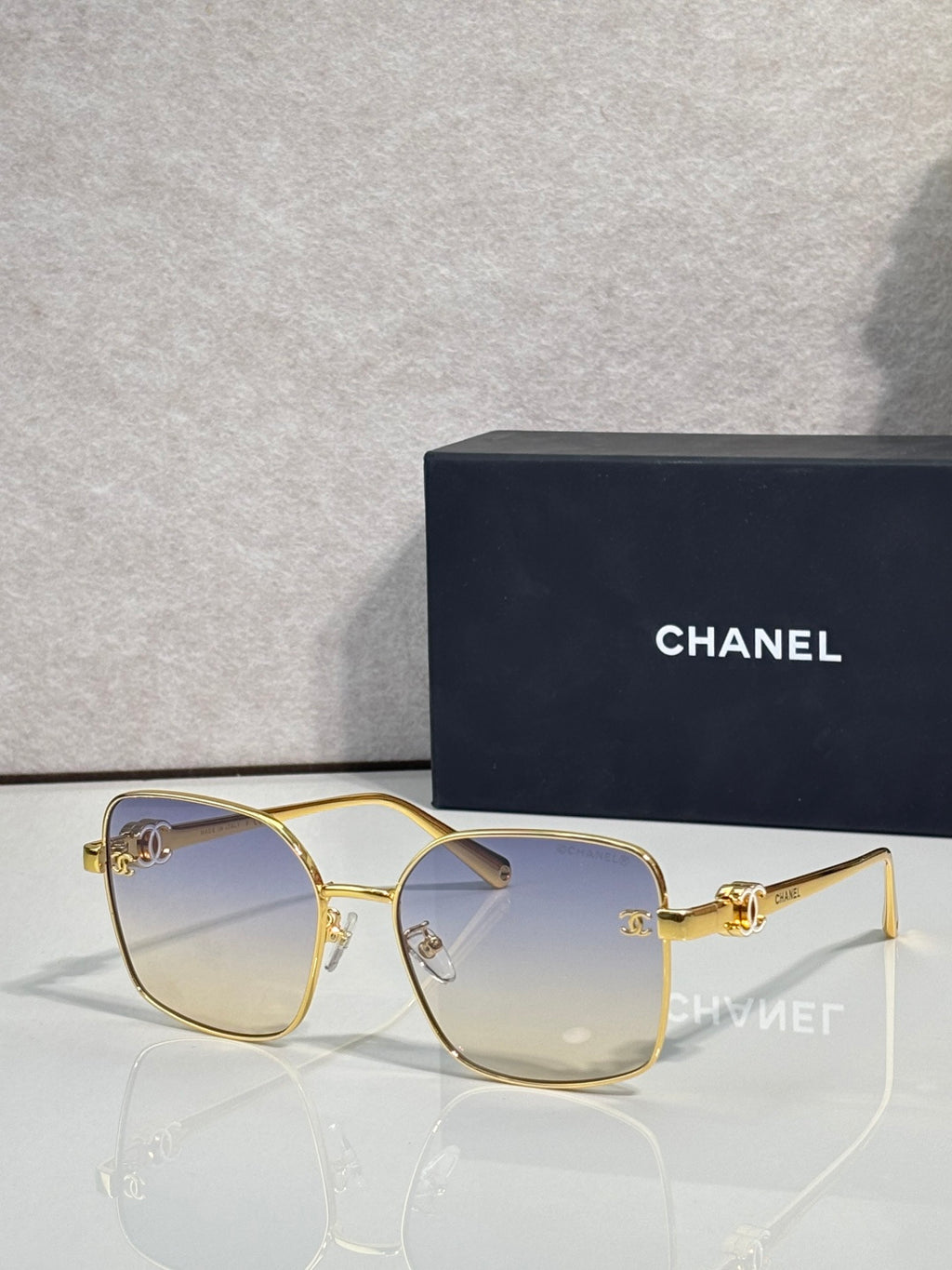 Gold-tone eyeglasses with clear tinted lenses and thin metal frames