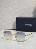 Gold-tone eyeglasses with clear tinted lenses and thin metal frames