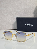 Gold-tone eyeglasses with clear tinted lenses and thin metal frames