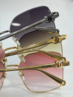 Gold-tone eyeglasses with purple-tinted lenses and black branded temple