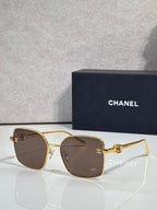 Gold-tone eyeglasses with brown-tinted lenses and slim metal frame