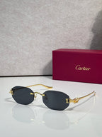 Gold-tone round sunglasses with dark-tint lenses and thin metal arms