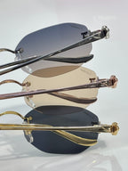 Close-up of stacked round sunglasses showing lens tints and metal temple arms