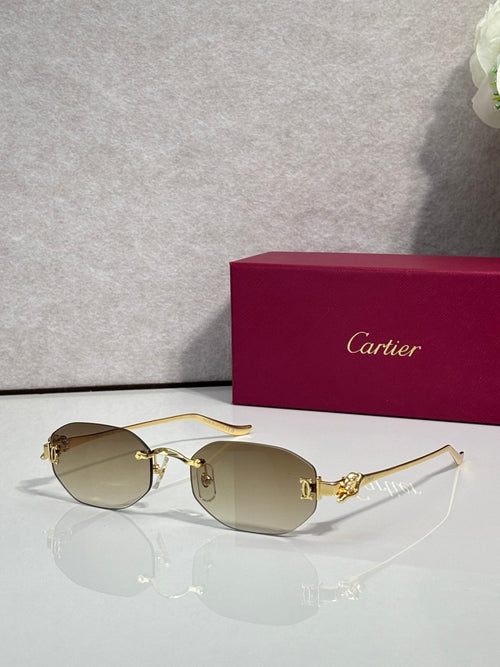 Gold-tone round sunglasses with tan lenses and slim metal arms
