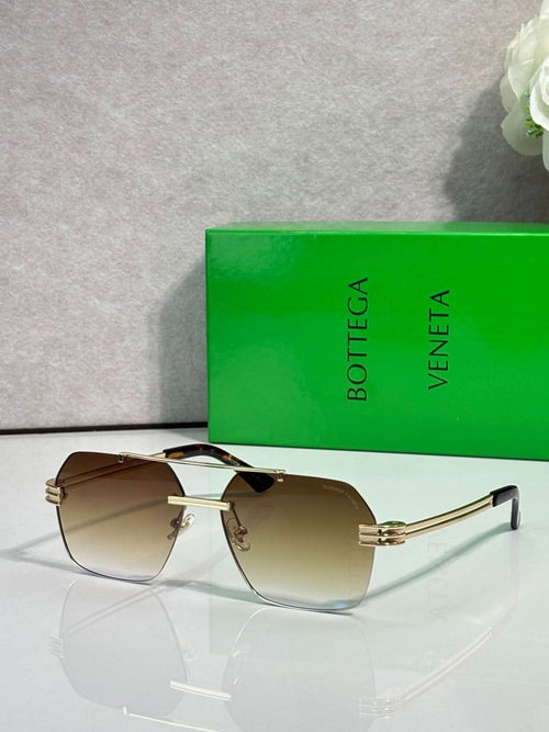 Bottega Veneta sunglasses with brown gradient lenses and gold metal frame