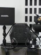 Chanel black mini bag with front flap and quilted diamond panel