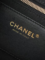 Chanel Made in Italy stamp on black leather bag edge