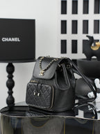 Chanel black bucket bag with chain strap and quilted front zip pocket