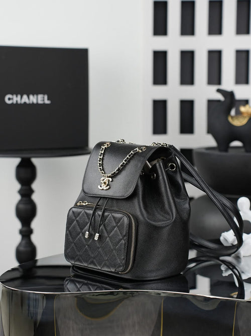 Chanel black bucket bag with chain strap and quilted front zip pocket